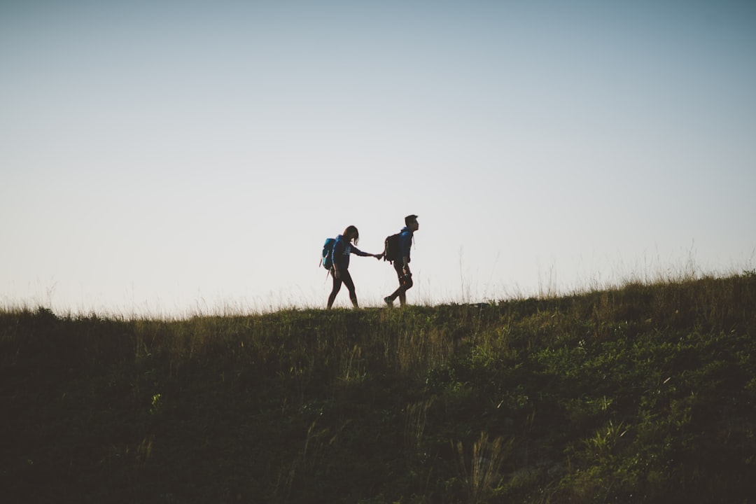 man and woman hugging each other photography