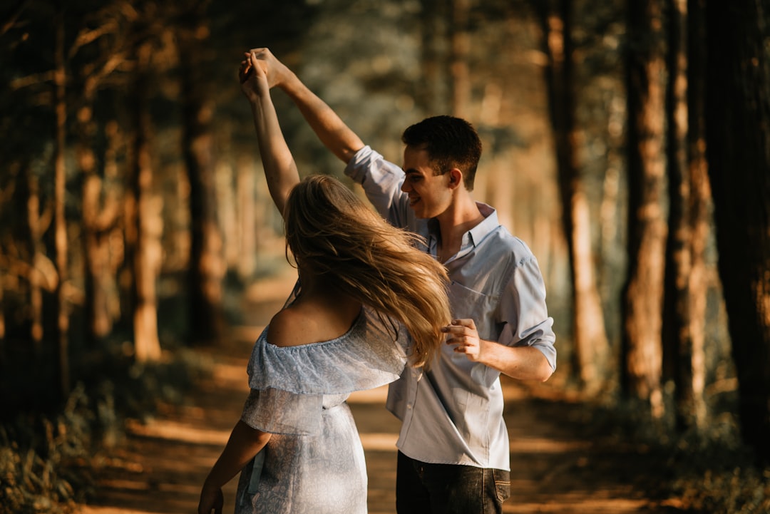 two person holding papercut heart