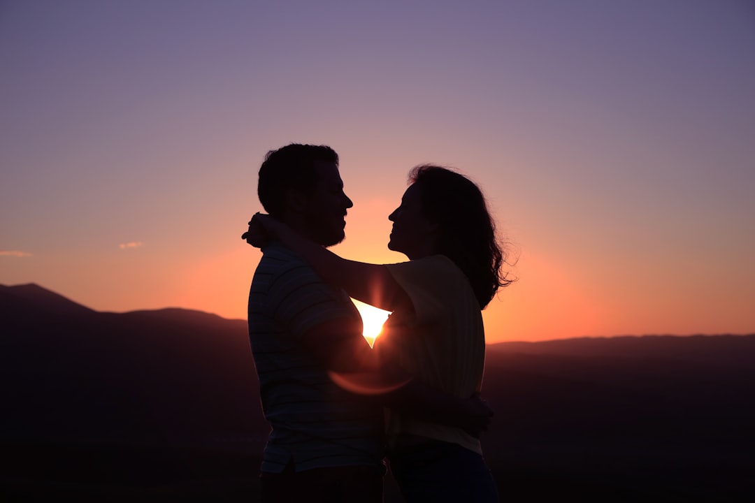 man and woman holding hands
