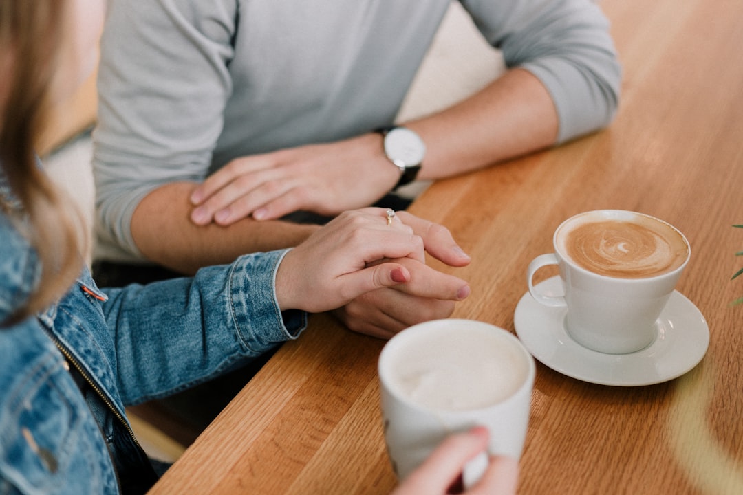 man and woman holding hand together